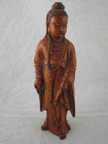 Appraisal: A Chinese carved boxwood figure of Guan Yin ht cm