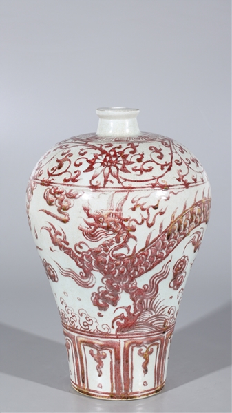 Appraisal: Chinese red and white vase featuring a dragon design and