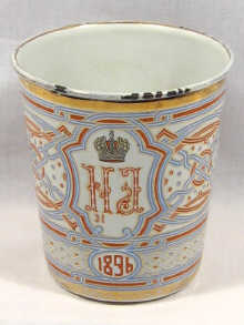 Appraisal: A Russian enamelled metal beaker commemorating the coronation of Tsar