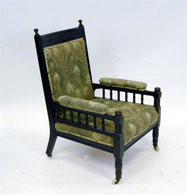 Appraisal: An Aesthetic Movement ebonised wood arm chair with turned legs