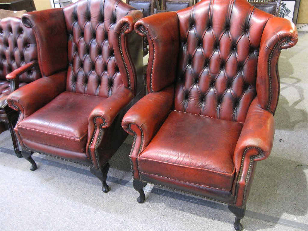 Appraisal: Pair of leather upholstered button back chairs