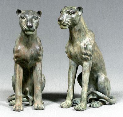 Appraisal: Pair patinated bronze lions or jaguars each seated with articulated