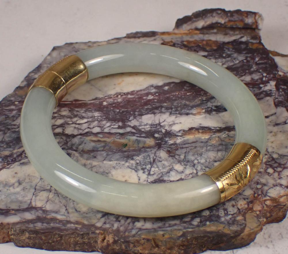 Appraisal: JADE AND FOURTEEN KARAT GOLD BANGLE BRACELET having a ring