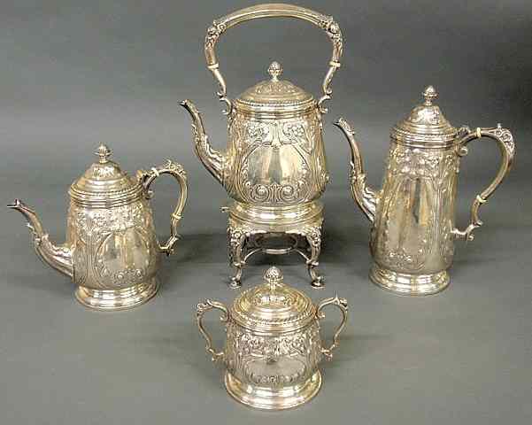 Appraisal: Sterling silver four-piece tea with an ornate chased floral decoration