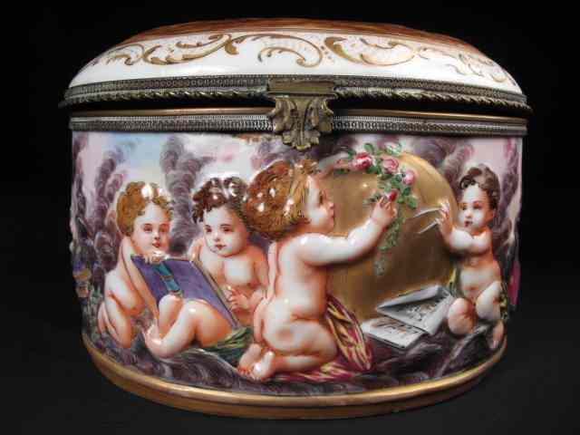 Appraisal: Capodimonte jewelry casket Italian painted depicts nude cherubs Brass mounts