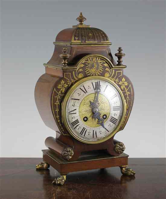 Appraisal: A French brass inset mahogany mantel clock in Estimate -