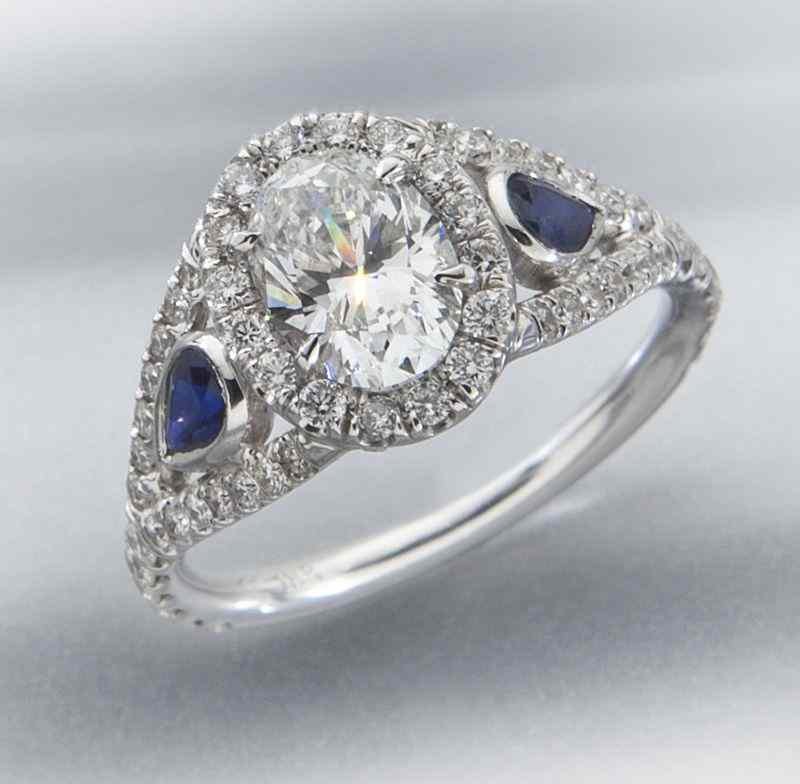 Appraisal: K gold sapphire and diamond ring the central oval brilliant