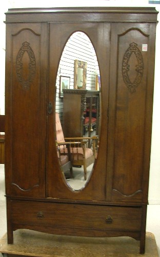 Appraisal: AN OAK WARDROBE ON STAND English early th century the