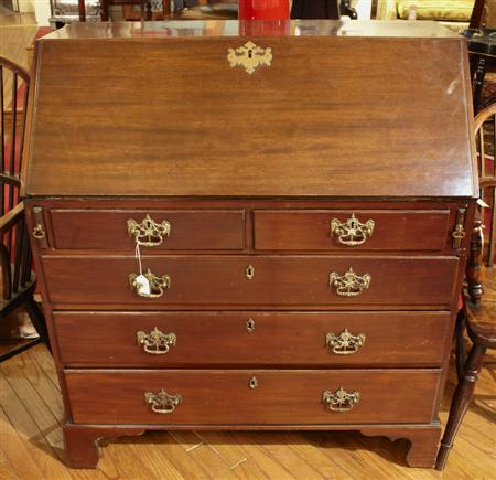 Appraisal: A George III mahogany bureau the fall flap enclosing pigeon