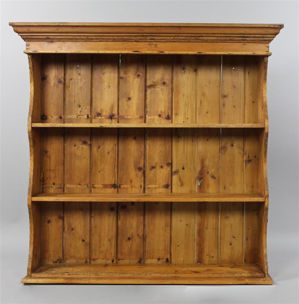 Appraisal: PROVINCIAL PINE HANGING SHELF having scalloped-edge sides the molded edge