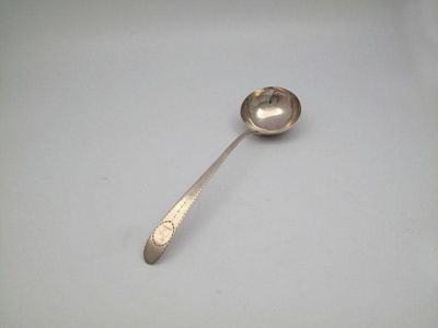 Appraisal: A George III Irish silver Bright-cut soup ladle Dublin the