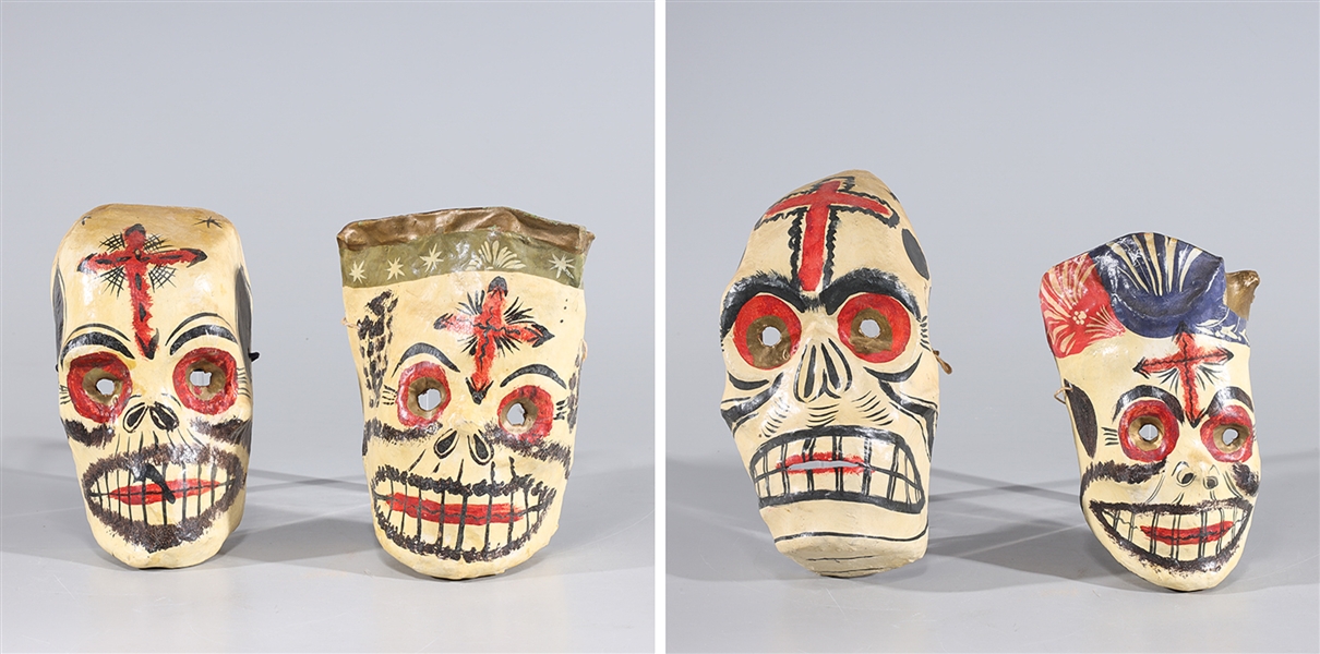 Appraisal: Group of four Mexican paper mache painted skull masks with