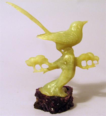 Appraisal: Chinese celadon jadeite model of a sparrow Modeled with tail