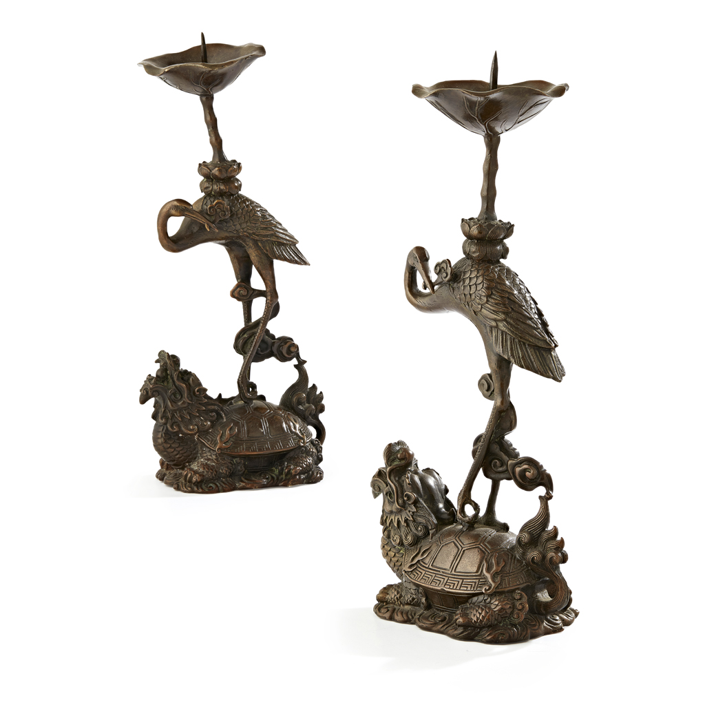 Appraisal: PAIR OF BRONZE CANDLE STICKS cast in the form of