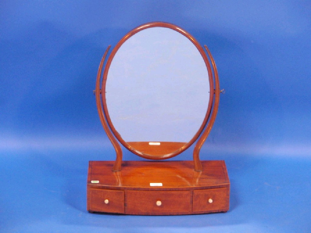 Appraisal: A Georgian mahogany oval toilet mirror on slender tapered supports