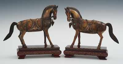 Appraisal: A Pair of Carved Ivory or Bone Horses on Stands