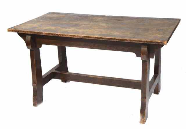 Appraisal: AN ARTS AND CRAFTS OAK REFECTORY TABLE with stylised base