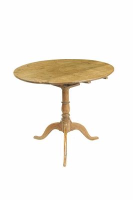 Appraisal: An oak tripod table the circular tilt-top revolving on a