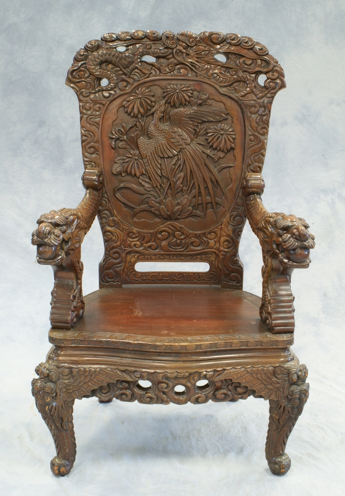 Appraisal: Dragon carved Asian armchair with palm trees and bird of