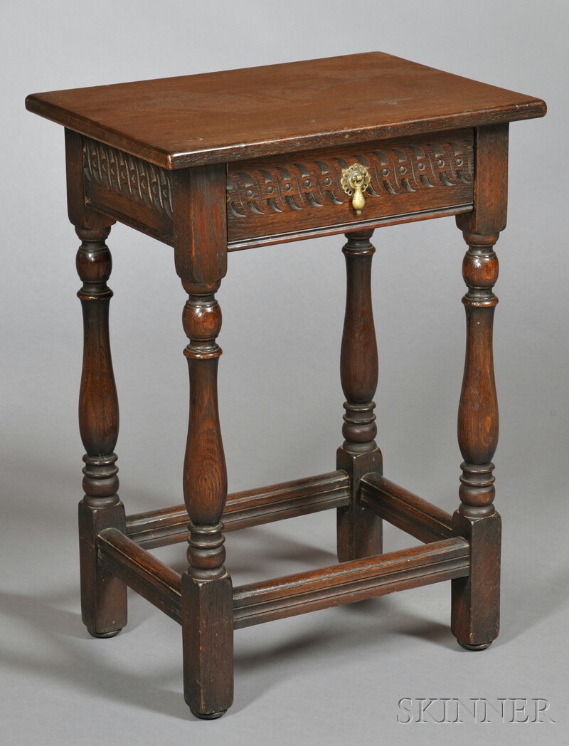 Appraisal: Jacobean-style Oak Stand th century with a single drawer frieze