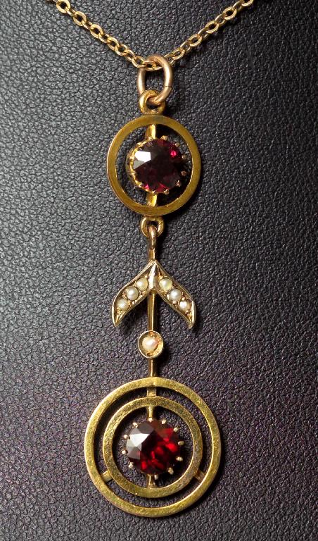 Appraisal: EDWARDIAN ct GOLD SEED PEARL AND GARNET PENDANT the two