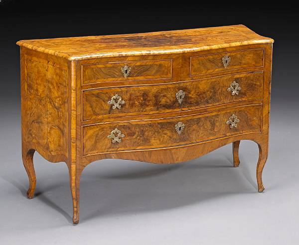 Appraisal: An Italian Rococo walnut chest mid th century The serpentine