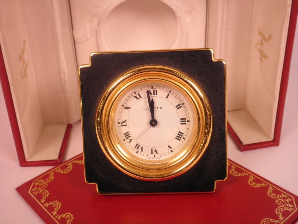 Appraisal: A Les Must De Cartier travelling clock in a gilt