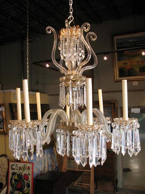 Appraisal: EIGHT LIGHT CRYSTAL CHANDELIER With scalloped drip pans enriched with