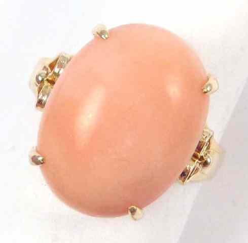 Appraisal: PINK CORAL AND FOURTEEN KARAT GOLD RING Four yellow gold