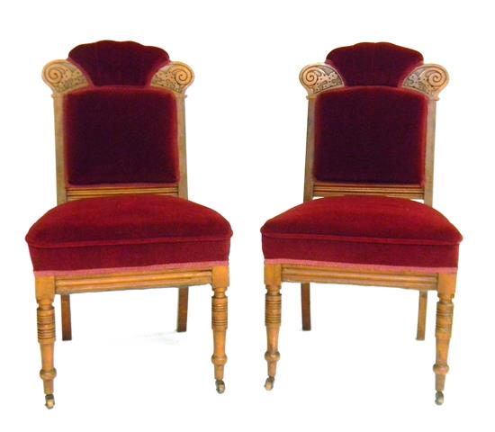 Appraisal: Pair of Victorian side chairs th C walnut cranberry upholstery