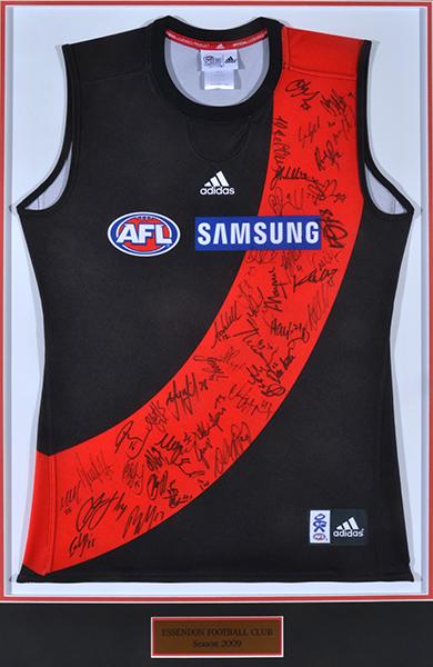 Appraisal: ESSENDON AFL JERSEY SIGNED BY TEAM FRAMED