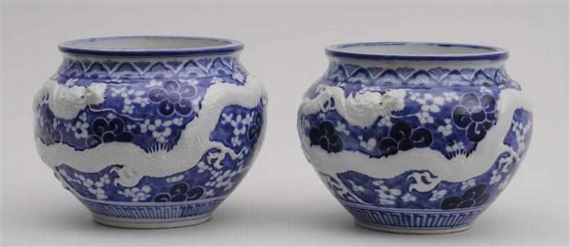 Appraisal: PAIR OF JAPANESE BLUE AND WHITE JARDINI RES Each relief