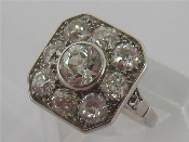 Appraisal: An Art Deco diamond and platinum plaque ring the central