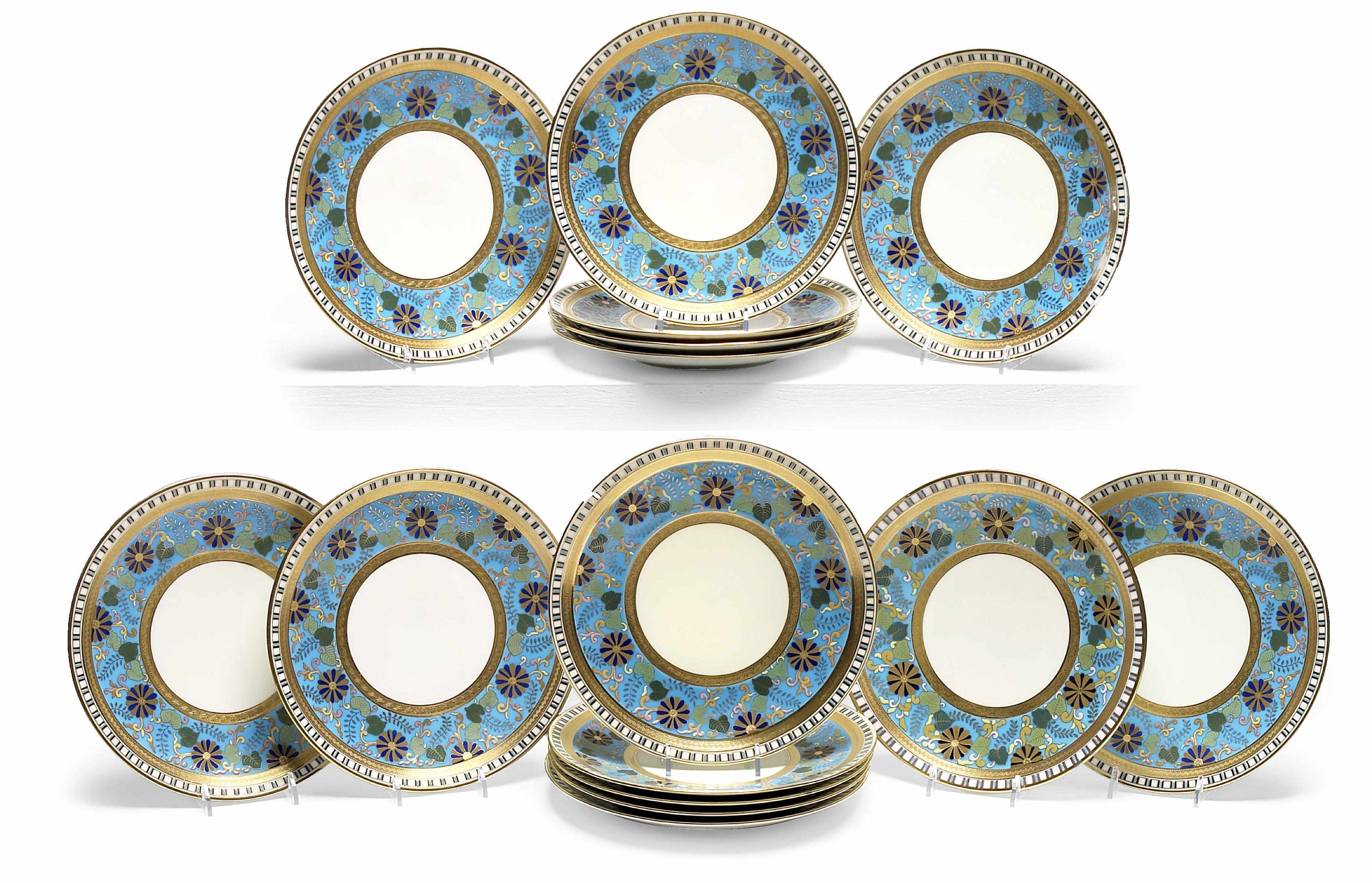 Appraisal: A set of fifteen Mintons Aesthetic decorated dessert plates retailed