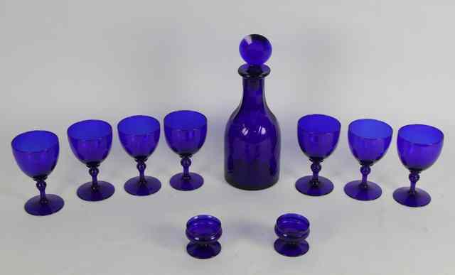 Appraisal: A George III style blue glass decanter and stopper seven