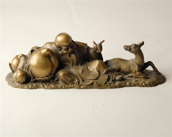 Appraisal: A Chinese Gilt Bronze Buddha and Fawn Sculpture detailed recumbent