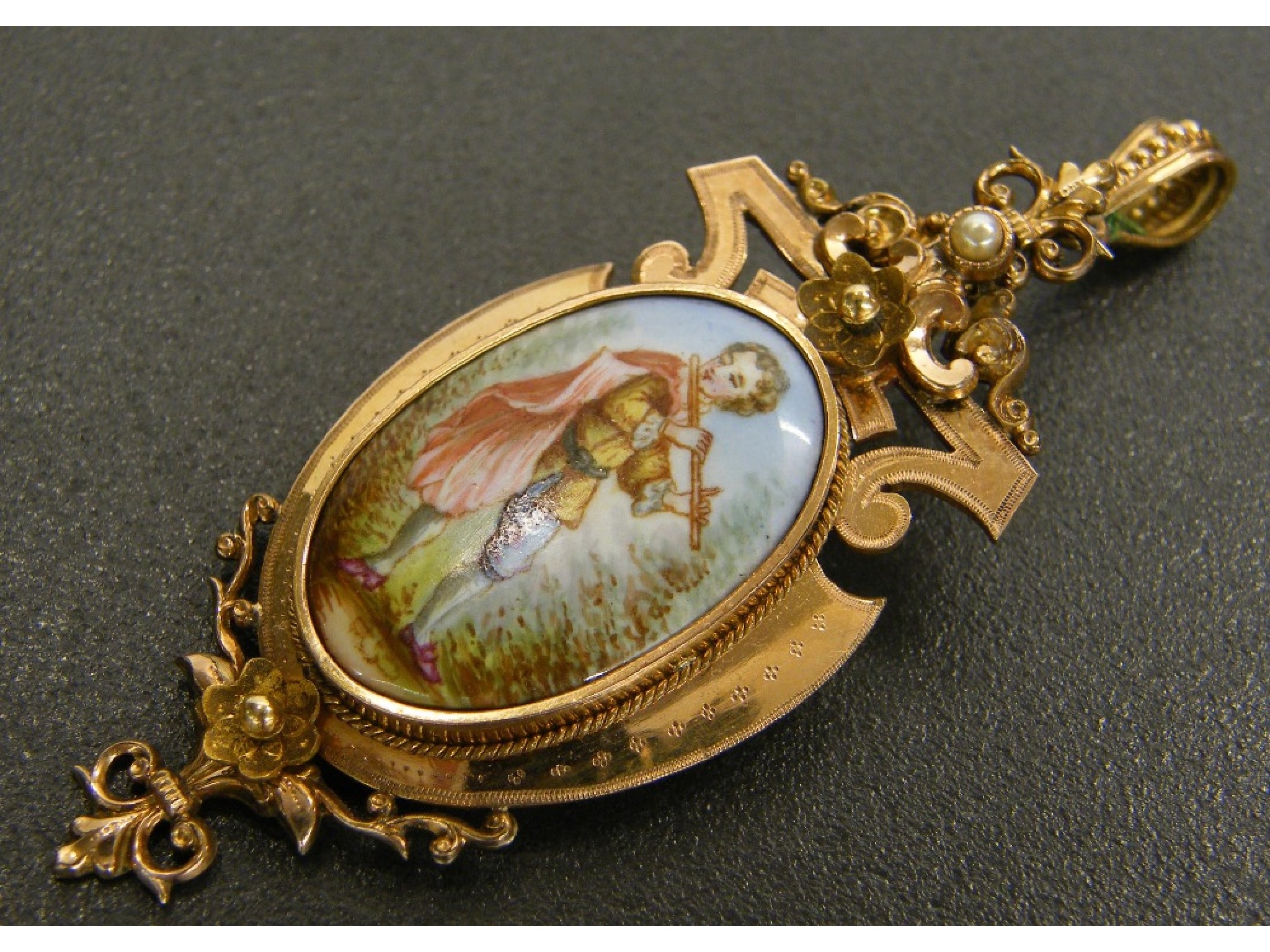 Appraisal: th century oval yellow gold and enamel pendant with an