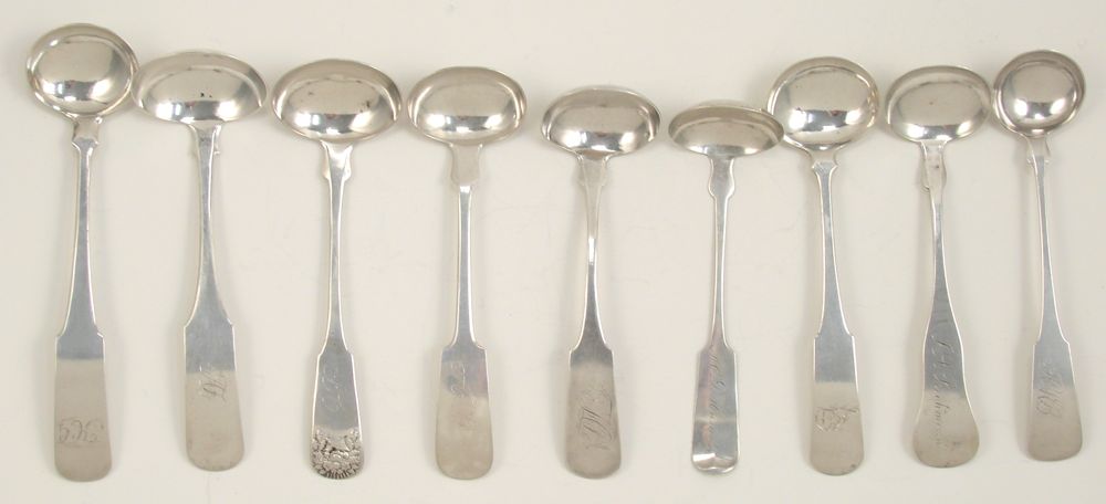 Appraisal: NINE COIN SILVER CREAM LADLES th CenturyBy various makers including