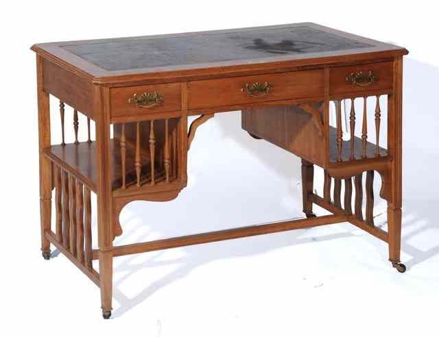 Appraisal: AN EDWARDIAN WALNUT DESK fitted three frieze drawers and inset