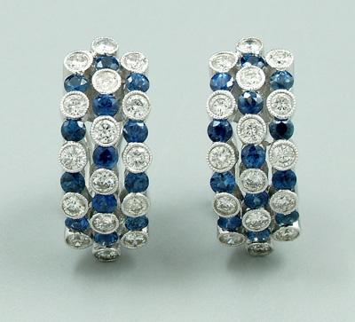 Appraisal: Pair sapphire and diamond earrings set with round brilliant diamonds