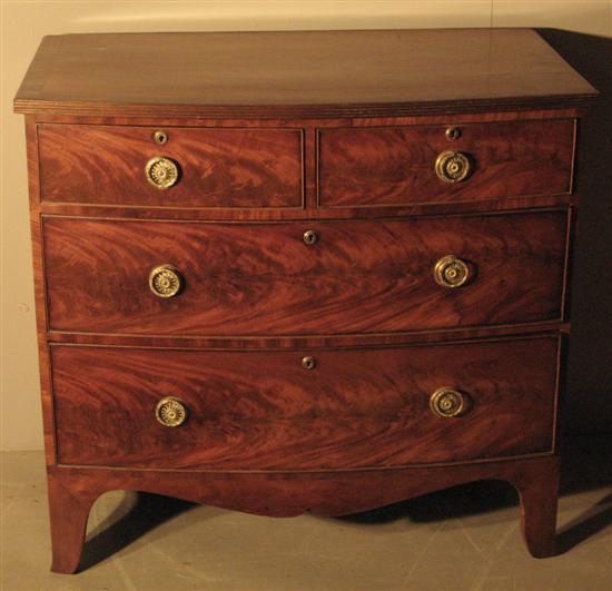 Appraisal: th century mahogany and crossbanded bow fronted chest of two