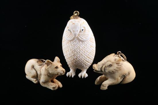 Appraisal: THREE JAPANESE AND OTHER CARVED IVORY ANIMAL PENDANTS Including boar