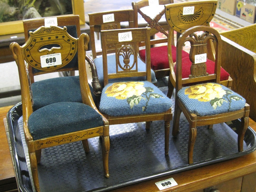 Appraisal: Lot comprising seven miniature dining chairs