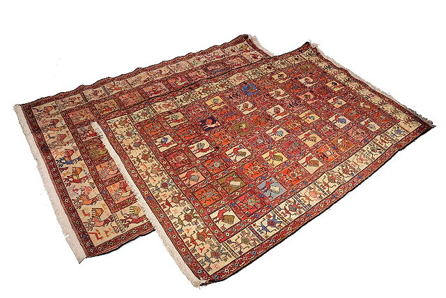 Appraisal: A MATCHED PAIR OF IRANIAN PART SILK RUGS each decorated