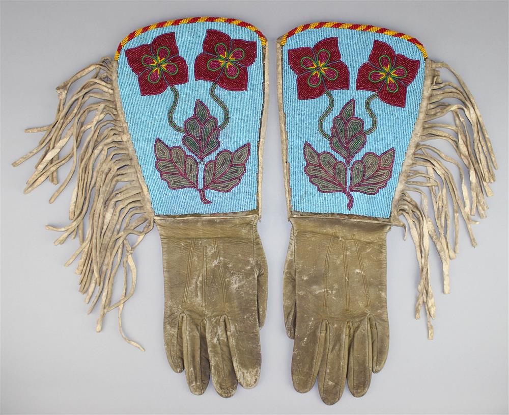 Appraisal: PAIR OF PLATEAU BEADED AND FRINGED HIDE GAUNTLETS NEZ PERCE