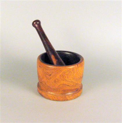 Appraisal: Lignum Vitae mortar and pestle The plain cylindrical mortar with