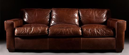 Appraisal: Contemporary brown leather upholstered sofa Leather Master three cushion back