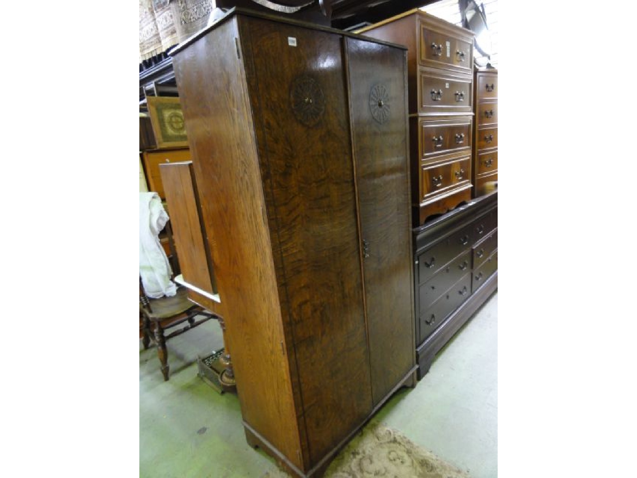 Appraisal: An early th century oak wardrobe enclosed by a pair