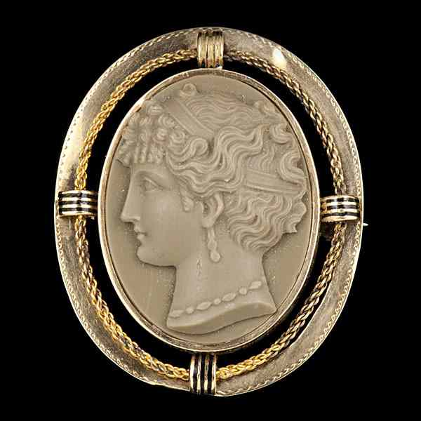 Appraisal: Greek-Style Cameo An olive color high relief cameo carved to