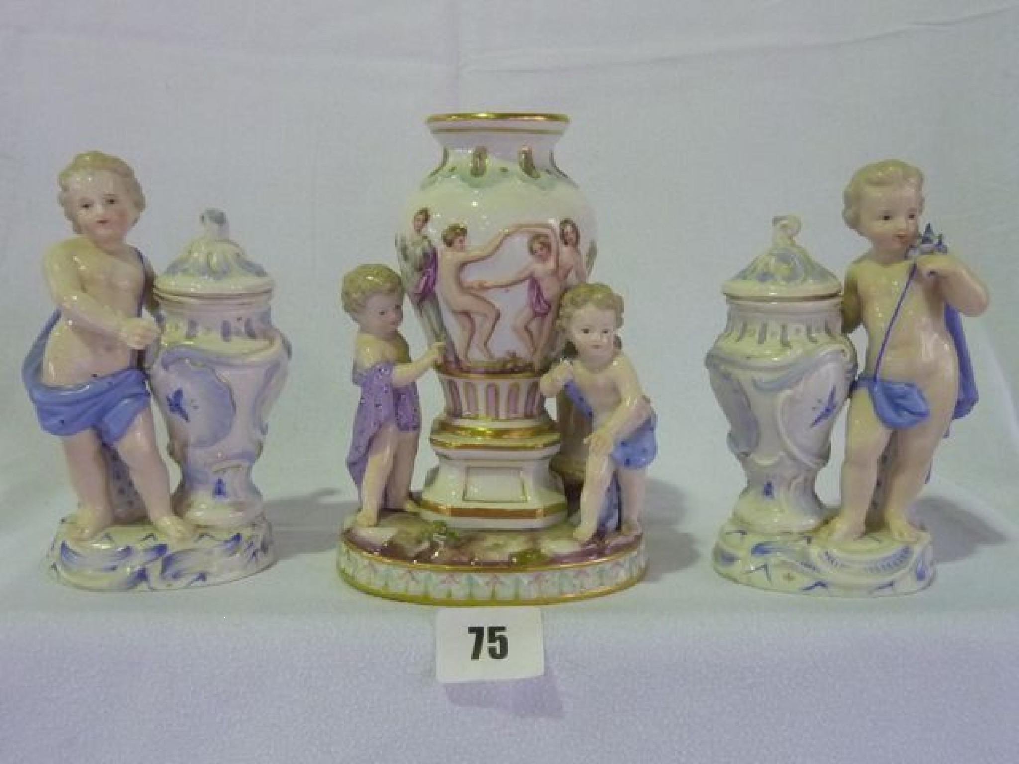 Appraisal: A pair of figural vases and covers each modelled as